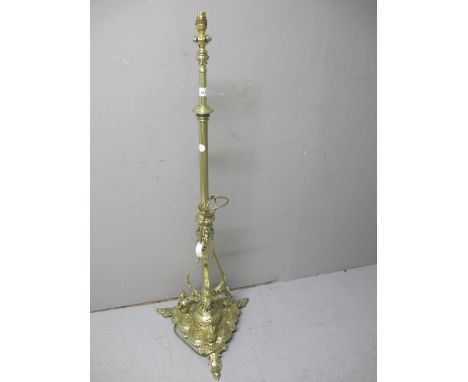 A VICTORIAN BRASS TELESCOPIC FLOOR STANDARD LAMP the cylindrical column raised on a pierced shaped platform with foliate and 