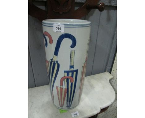 A GLAZED CHINA STICK STAND of cylindrical form the white ground decorated with umbrellas 45cm (h) x 19cm (d)