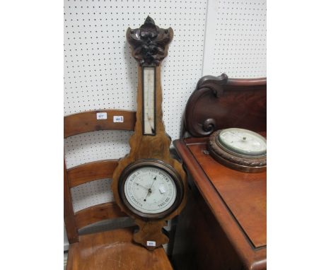 A WALNUT CASED BANJO BAROMETER together with an Edwardian oak cased barometer of circular outline with gadrooned rim