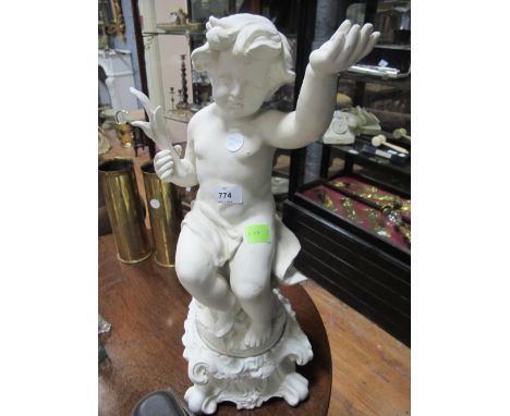 A BISQUE FIGURE modelled as a putti shown seated on a naturalistic base raised on scroll pedestal 162cm high