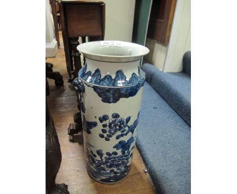 AN ORIENTAL STICK STAND the white and blue ground decorated with flowerheads and foliage with figural handles 56cm (h) x 23cm