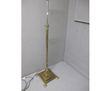 A BRASS AND CHROME TELESCOPIC FLOOR STANDARD LAMP the reeded column with corinthian capital above a square stepped base 165cm