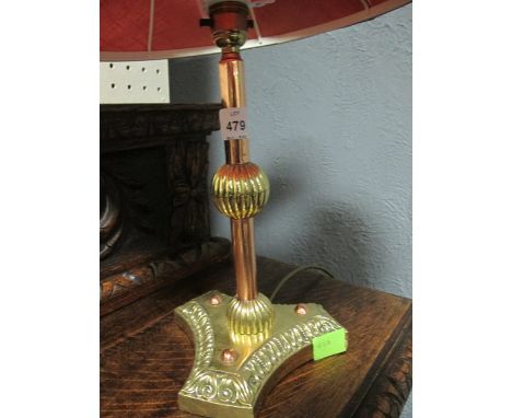 A VICTORIAN BRASS AND COPPER TABLE LAMP the cylinderical knoped column on concave base with shade 55cm high