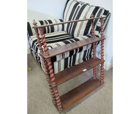 A VICTORIAN MAHOGANY THREE TIER WALL BRACKET each moulded shelf joined by a spiral twist support