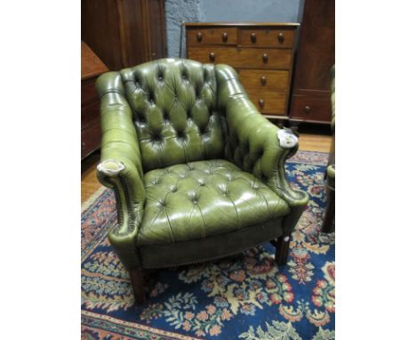 A GREEN HIDE UPHOLSTERED LIBRARY CHAIR with deep button upholstered back and seat on moulded legs (AF)