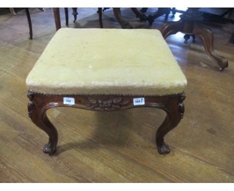 A VICTORIAN MAHOGANY STOOL the square upholstered seat above a carved apron on cabriole legs 40cm (h) x 55cm (s)