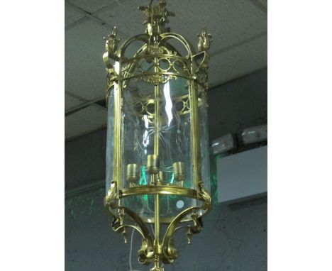 A CONTINENTAL GILT BRASS FOUR LIGHT HALL LANTERN of cylindrical form with etched glass panels with scroll and foliate decorat