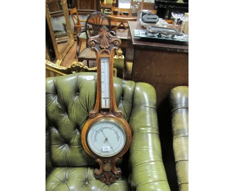 A VICTORIAN OAK BANJO BAROMETER the carved frame with porcelain dials 85cm high