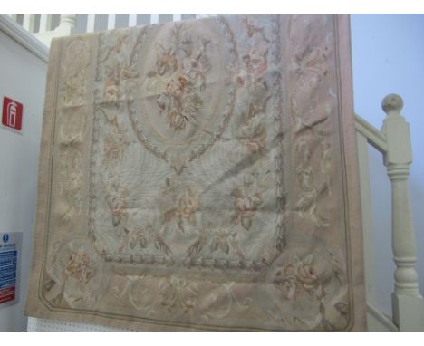 AN AUBUSSON TAPESTRY the light pink ground with central floral panel within a conforming border