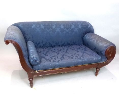 William IV mahogany and upholstered sofa, with a scroll end and covered in a deep blue damask, 167cm w