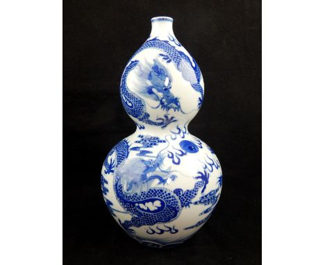 Chinese double gourd vase, blue & white glaze, three dragons chasing flaming pearl, two rings and six character marks to base