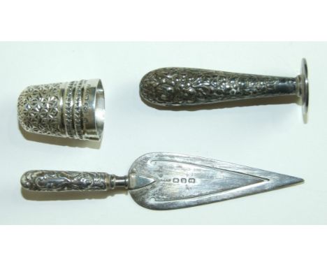 A Victorian silver trowel bookmark, Birmingham 1896, a Charles Horner thimble (af) and a small sterling silver seal, (3).