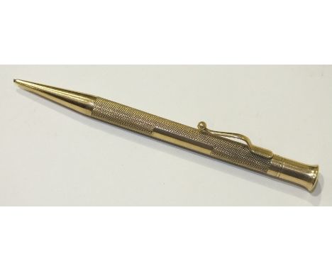 The Mascot, a 9ct gold propelling pencil with engine turned engraving, total wt 2.5g.
