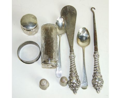 A silver handled shoehorn and matching button hook, Birmingham 1907, two small dressing table silver topped jars and other sm