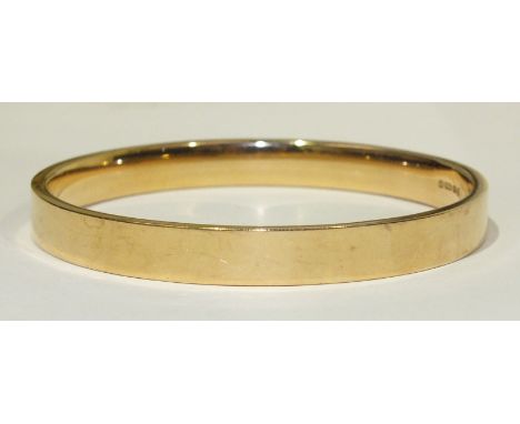 A 15ct rose gold slave bangle, 8cm diameter, 18.5g.