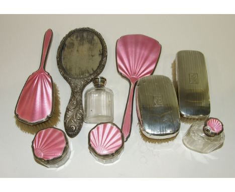 A six-piece silver and pink guilloche enamel dressing table set : brush, mirror and four glass jars/bottles (some af), Mappin