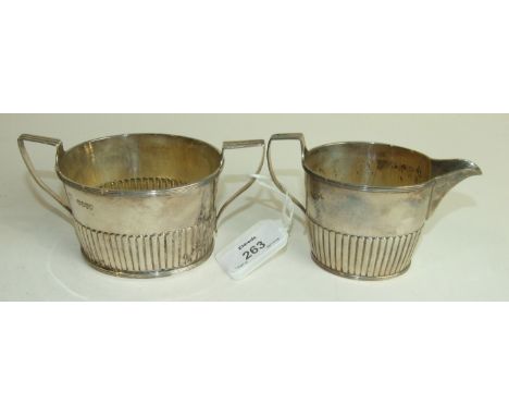 A Victorian silver sugar basin and cream jug of tapered half reeded form, London 1882/3___8.5oz.