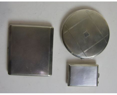 An engine turned silver cigarette case by Mappin & Webb Ltd, 8.5 x 10cm, a circular engine turned silver compact with mirrore