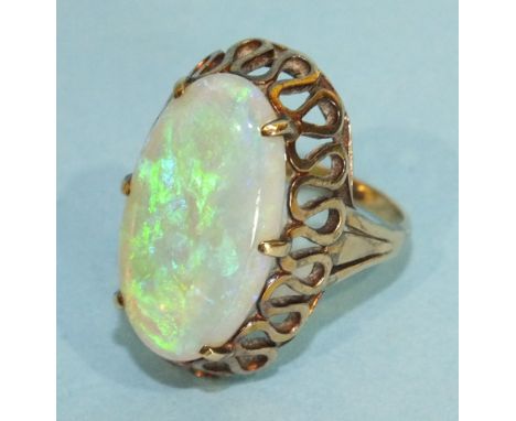 A 14k gold ring claw set a large oval water opal, (2.3 x 1.3cm), size O, 8.6g.