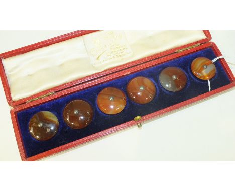 A set of six agate buttons in fitted box, each button 2.5cm diameter.