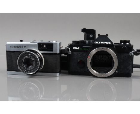 Two Olympus Cameras, an Olympus Trip 35, shutter working, light cell responsive, aperture responsive in auto setting, body G,