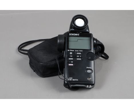 A Sekonic L-508 Zoom Master Digital Light Meter, powers up, appears to function as should, some light wear to lettering aroun