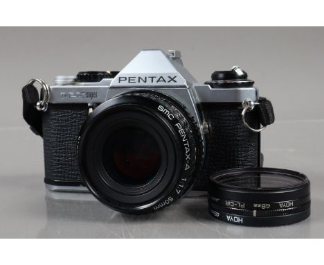 A Pentax ME Super SLR Camera, shutter working, meter responsive, self timer working, body G, some signs of battery leakage to