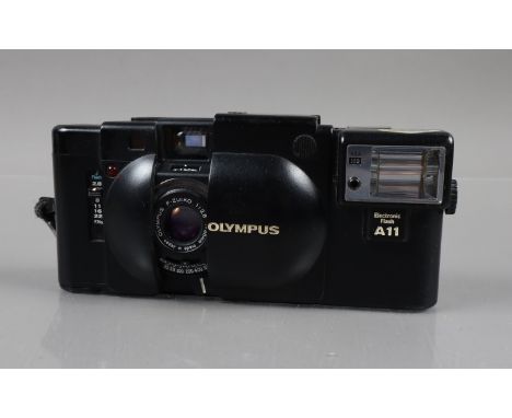 An Olympus XA Compact Camera, shutter working, rangefinder functions, self timer working, body G, elements G, with untested A