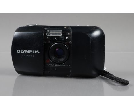 An Olympus mju 1 Compact Camera, powers up, shutter working, flash working, self timer working, body G, some surface scratche