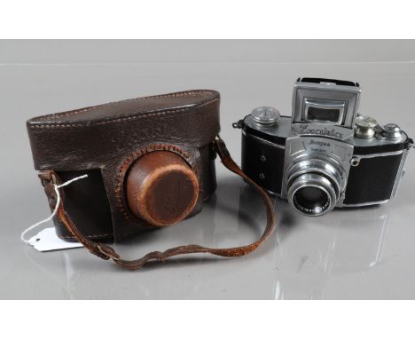 An Ihagee Exakta I Camera, with rectangular magnifier, shutter working, body G, some paint wear to edges, with Carl Zeiss 5cm