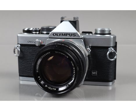 An Olympus OM-2n MD SLR Camera, chrome, shutter working in manual &amp; auto mode, meter responsive, self timer working, body