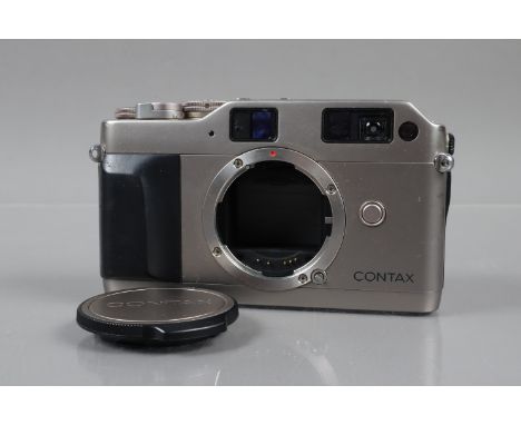 A Contax G1 rangefinder Camera Body, serial no 011802, power erratic, body G, light wear to back, with body cap 