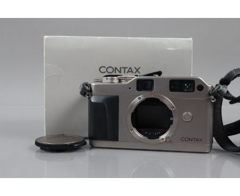A Contax G1 rangefinder Camera Body, serial no 084085, powers up, shutter working, appears to function as should, body G-VG, 