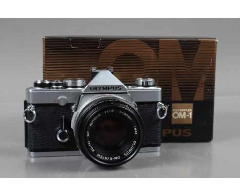 An Olympus OM-1 SLR Camera, shutter working, meter responsive, self timer working, body G, with Zuiko MC 50mm f/1.8 lens, bar