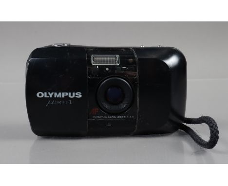 An Olympus mju 1 Compact Camera, powers up, shutter working, flash working, self timer working, body G, some surface scratche