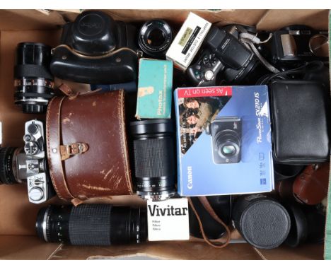 An Olympus OM-2n MD SLR Camera, shutter working, meter responsive, self timer working, body F, some paint wear to edges, some