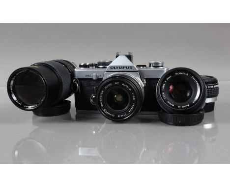 An Olympus OM-2 SLR Camera, shutter working, meter responsive, self timer working, body G, with Zuiko 50mm f/1.8 lens barrel 