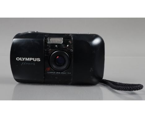 An Olympus mju 1 Compact Camera, powers up, shutter working, flash working, self timer working, body G, some surface scratche