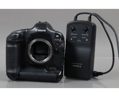 A Canon EOS-1 Ds DSLR Camera Body, powers up, shutter working, display working, appears to function as should, body G, some s