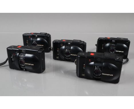 A Group Olympus XA Compact Cameras, two Olympus XA, one shutter button jammed, other shutter erratic, self timers working, bo