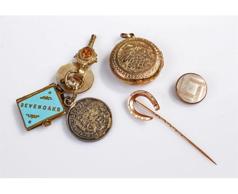 Assorted items including; a 9ct gold "horseshoe" tie pin, a gold plated locket, a watch key and fobs
