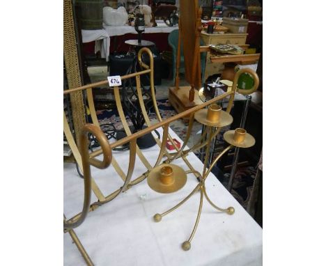 A metal folding magazine rack, a metal lamp and a metal triple candelabra.