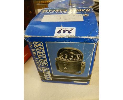A bracket mounted marine compass, as new.