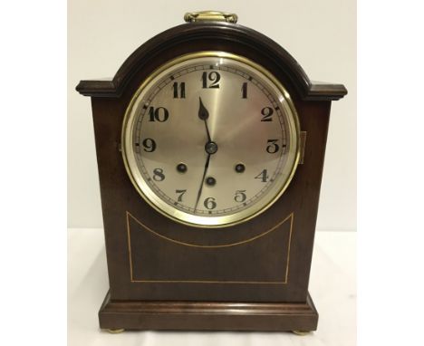 A reproduction wooden cased mantle clock by Bravingtons  Ltd, Kings Cross. With pendulum and key. Chiming mechanism needs att