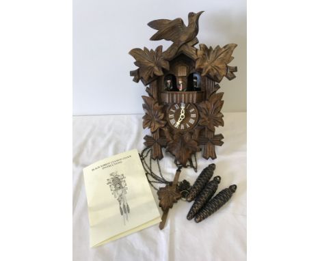 A modern Black Forest cuckoo clock. Complete with original instructions, pendulum and weights. 