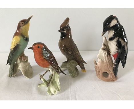 A collection of 4 ceramic Goebel birds to include a Bee eater and Waxwing.  