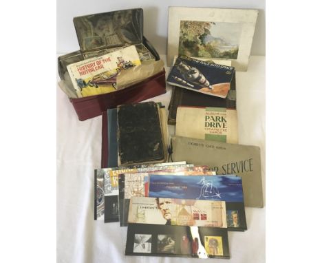 A collection of ephemera. To include , stamps, cigarette cards and albums, vintage notebooks and a journal. 