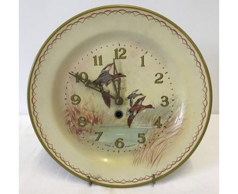 A Vintage Smiths tin plate wall clock with ducks in flight decoration to front.  Approx. 25cm diameter.