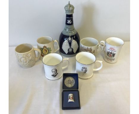 A quantity of Royal Commemorative ceramic items. To include Beswick and Royal Doulton Commemorative mugs and a Copeland Spode