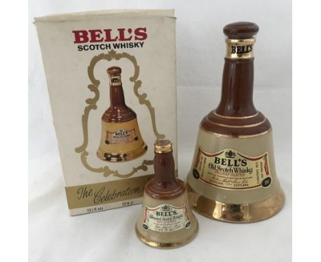 A sealed Wade Bells specially selected scotch whiskey ceramic decanter in original box. C 1970's. 37.8 cl, 70% proof. Togethe